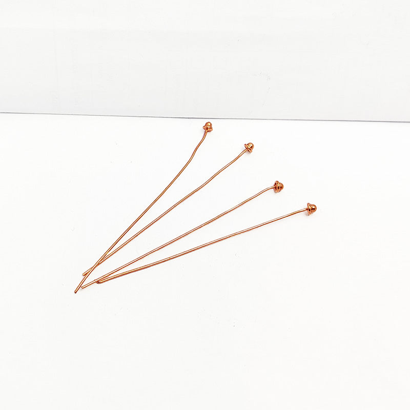 India handcrafted rose gold overlay over copper cone head pin for retail jewelry crafting.
