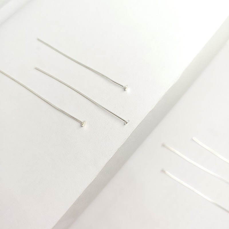 India handcrafted silver overlay over copper flat head pin for retail jewelry crafting.