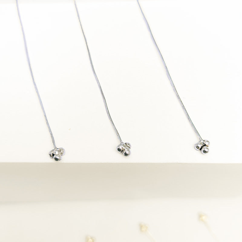 India handcrafted silver overlay over copper triple-ball head pin for retail jewelry crafting.