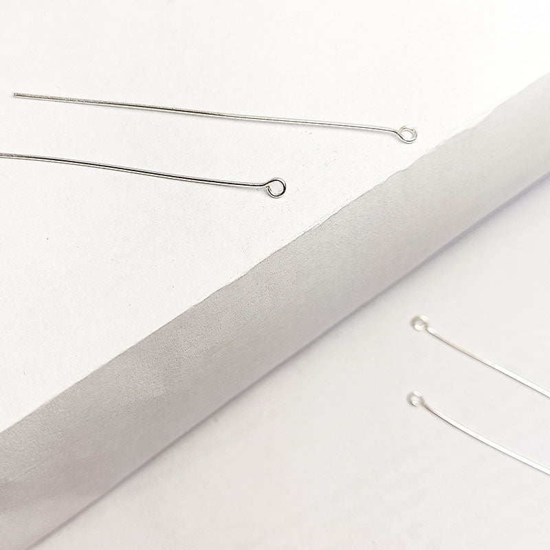 India handcrafted silver overlay over copper eye pin for retail jewelry crafting.