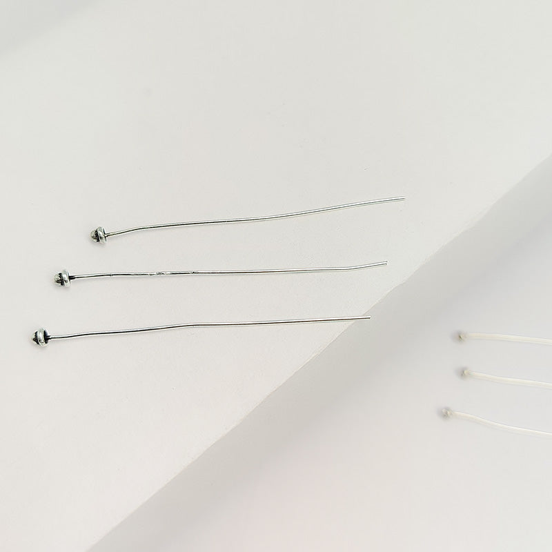 Handcrafted silver overlay headpin from India with a three-ball decorative tip.