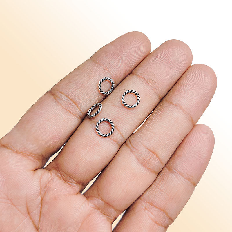 Elegant silver overlay twisted rope ring with oxidized finish, handcrafted in India, minimalist artisan jewelry.