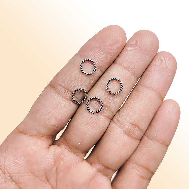 Elegant silver overlay twisted rope ring with oxidized finish, handcrafted in India, minimalist artisan jewelry.