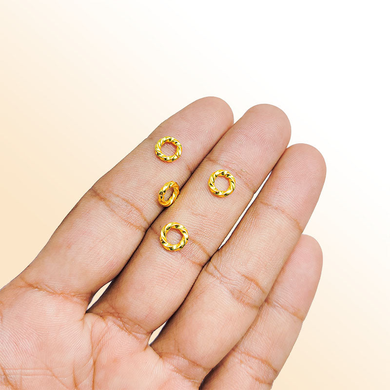 Elegant irregular twisted jump ring in 18K gold overlay over copper, polished finish, handcrafted in India.