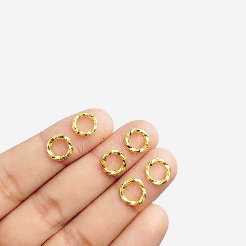 Elegant irregular twisted jump ring in 18K gold overlay over copper, polished finish, handcrafted in India.