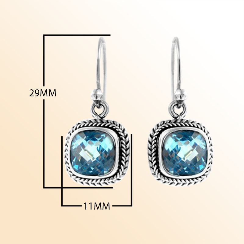 Handcrafted sterling silver dangle earrings with cushion cut blue topaz quartz and rope detailing made in Bali.