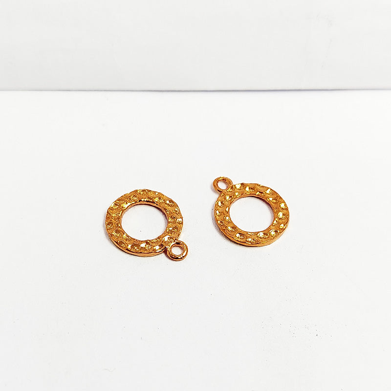 Handcrafted rose gold overlay over copper round charm from India with textured finish for elegant jewelry designs.