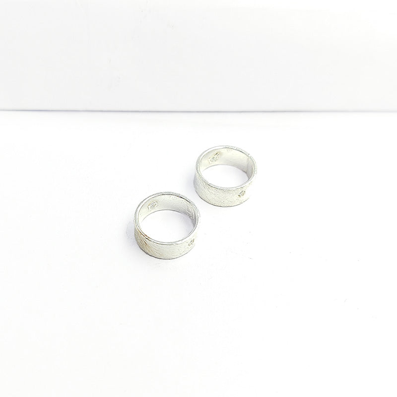 Modern wide band silver overlay over copper ring with subtle center detail and handcrafted finish made in India