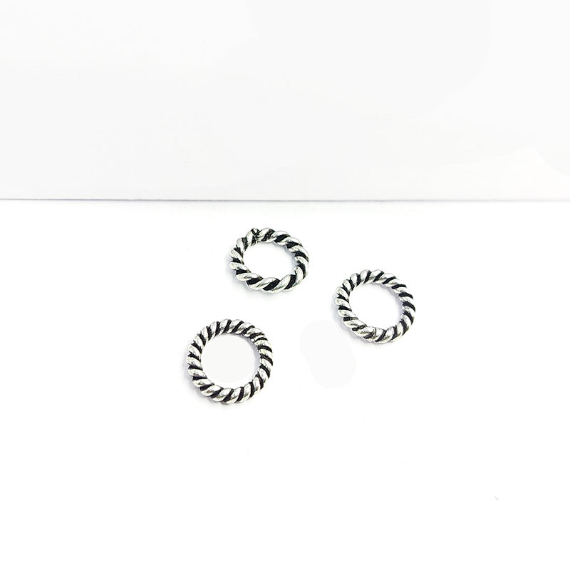 Handcrafted silver overlay twisted rope ring from India with vintage oxidized finish