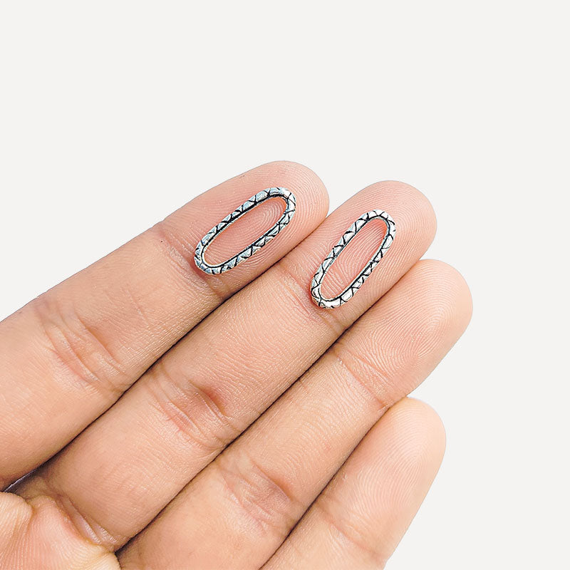 Geometric oval ring finding with criss-cross lattice border in silver overlay over copper, handmade in India