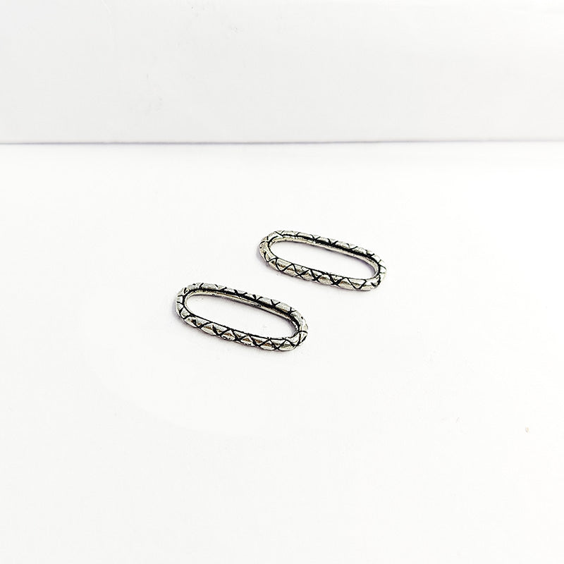 Geometric oval ring finding with criss-cross lattice border in silver overlay over copper, handmade in India