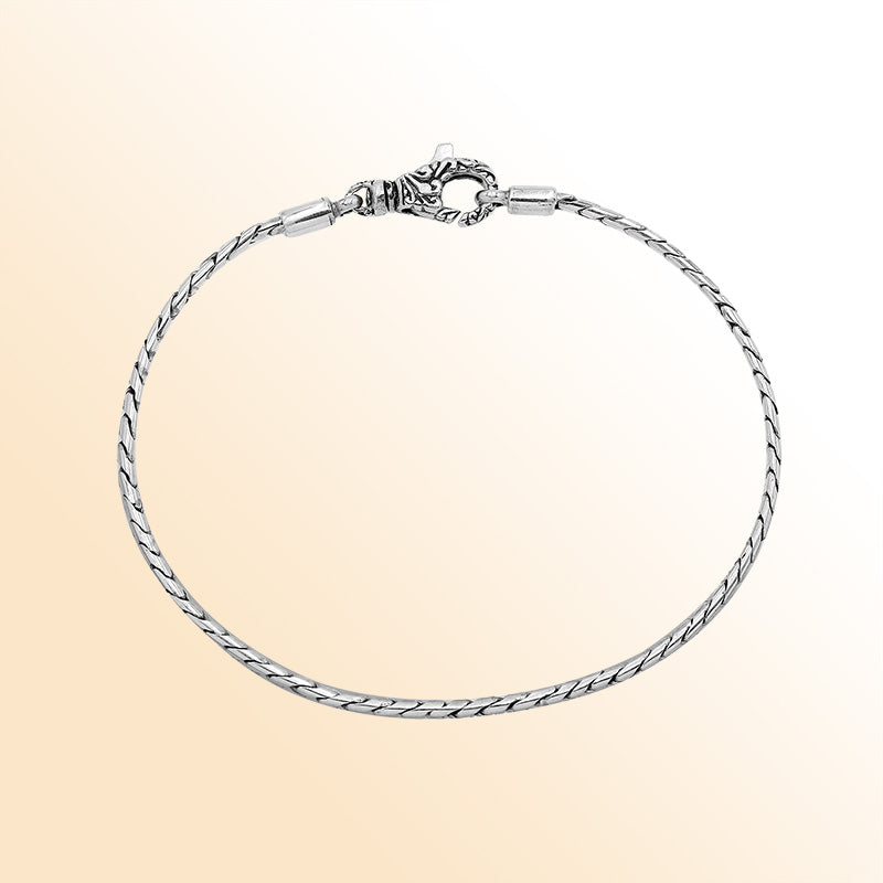 Handcrafted Sterling Silver Bali Slim Snake Chain Bracelet With Reflective Finish And Lobster Clasp.