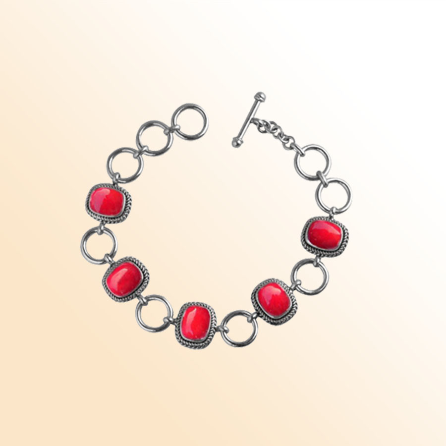 Handcrafted Sterling Silver Bracelet Featuring Red Coral Cushion Stones In Rope Bezels And Large Rings