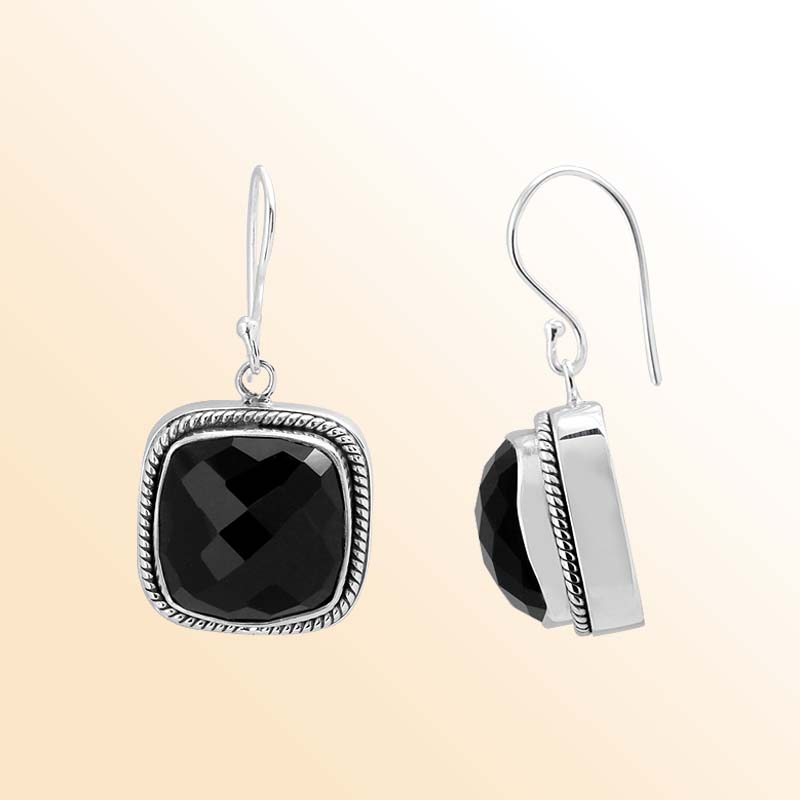 Handcrafted Sterling Silver earrings with Black Onyx stones in a cushion bezel design with rope-edge detailing.