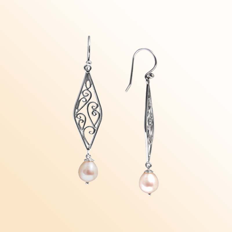 Handcrafted sterling silver filigree earrings adorned with lustrous teardrop freshwater pearls