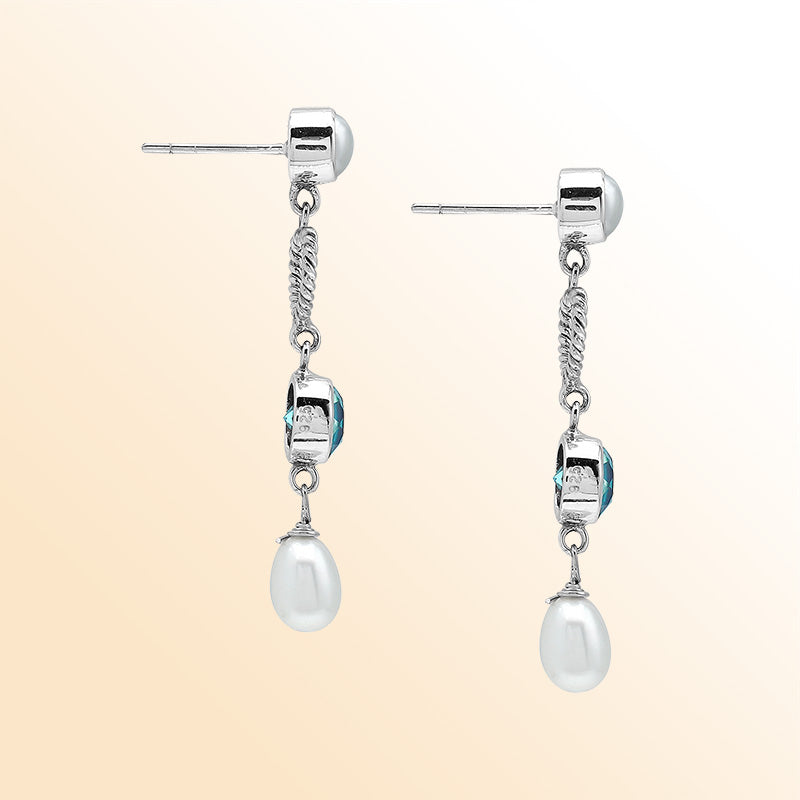 Handcrafted Sterling Silver earrings with Fresh Water Pearl and Blue Topaz Quartz featuring rope heart design and polished finish.