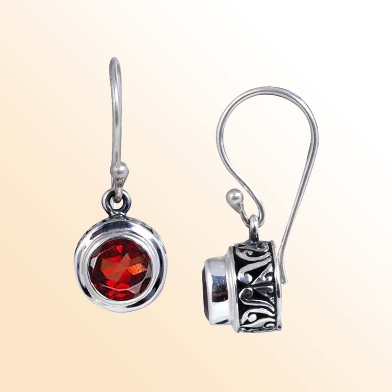 Elegant sterling silver round-shaped Garnet earrings with ornamental detailing and earwire lock, polished for refined shine and modern sophisticated jewelry appeal.