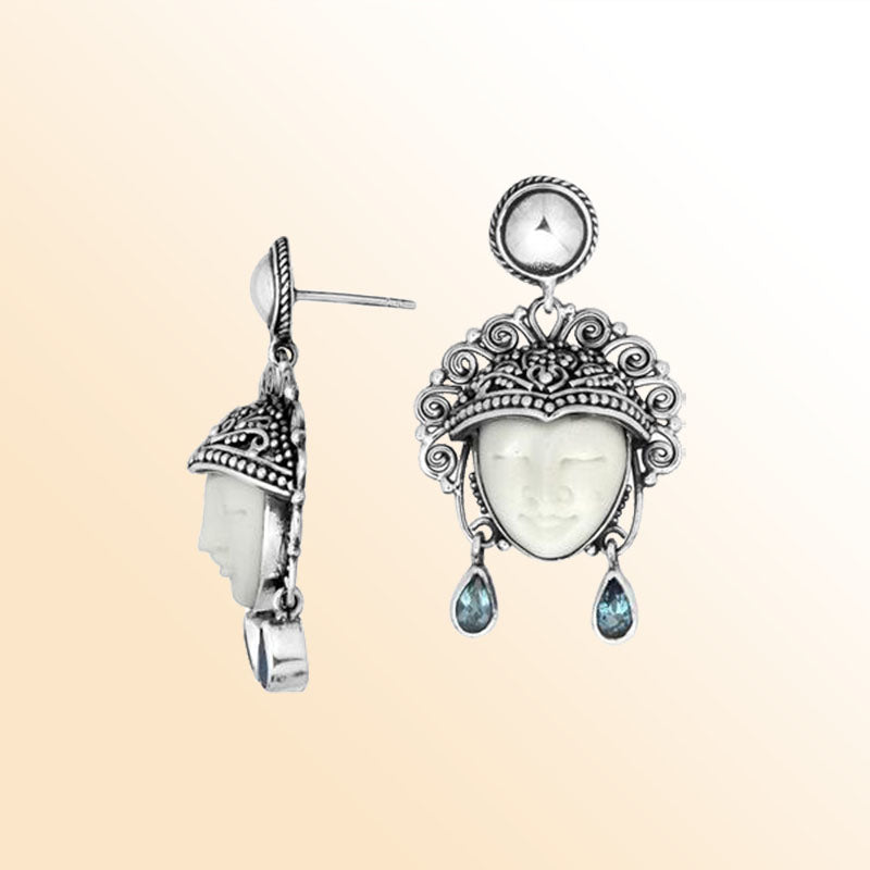 Handcrafted Sterling Silver Earrings With Carved Bone Face And Blue Topaz Quartz Teardrop Design
