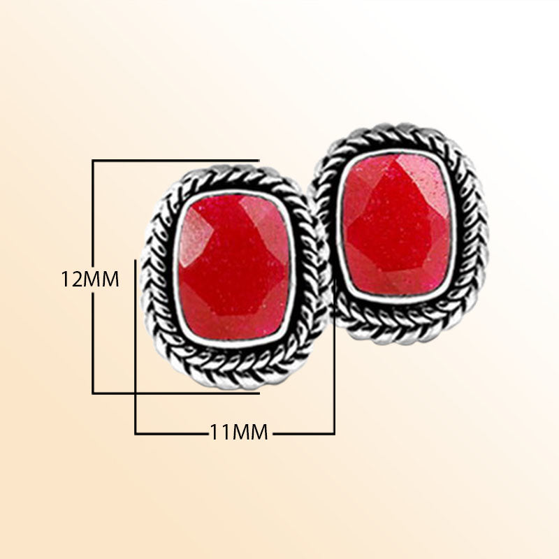 Artisan Sterling Silver Earrings With Radiant Ruby In Braided Cushion Design.