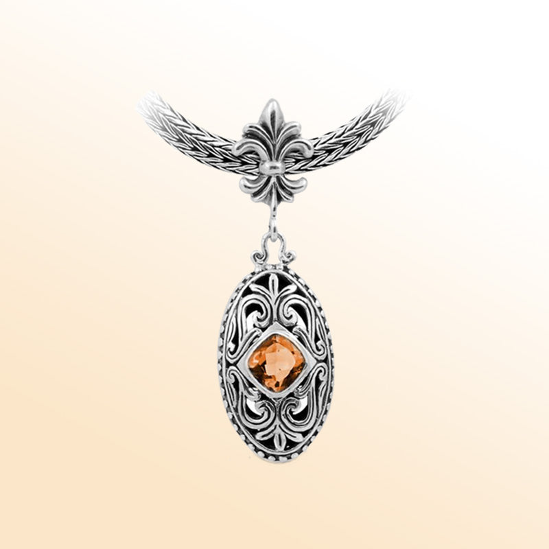 Handcrafted Sterling Silver Oval Pendant With Citrine Quartz And Fleur-De-Lis Bail Detailing.