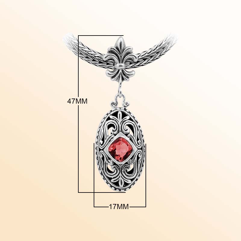 Handcrafted Sterling Silver Oval Pendant With Garnet Quartz And Fleur-De-Lis Bail Detailing.