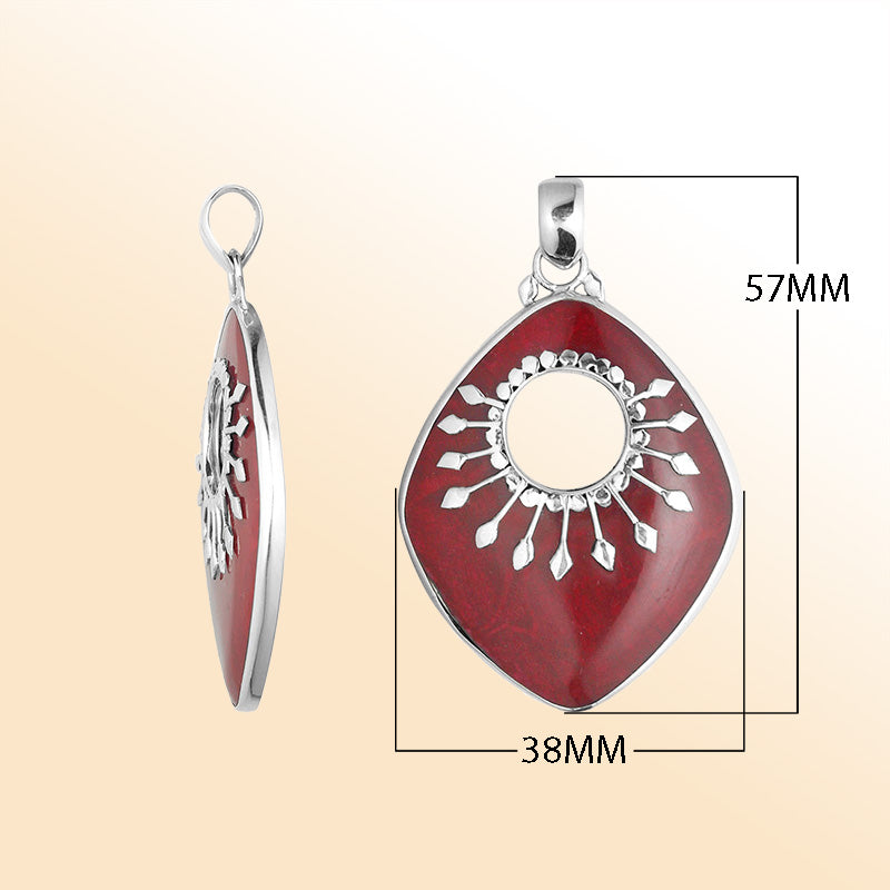 Handcrafted Sterling Silver Shield-Shaped Pendant With Red Coral And Sunburst Medallion.