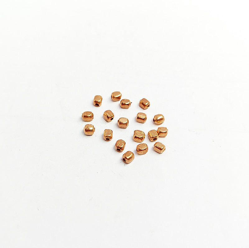 Handcrafted rose gold overlay copper washer bead from India with polished finish