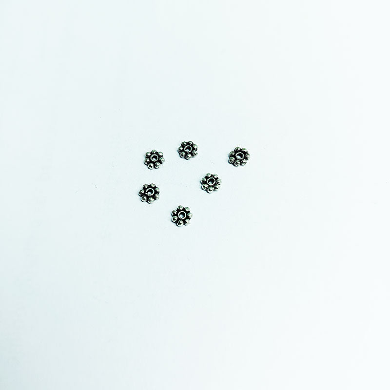 Floral spacer bead with center hole, Silver Overlay Over Copper, handcrafted in India for elegant jewelry designs.