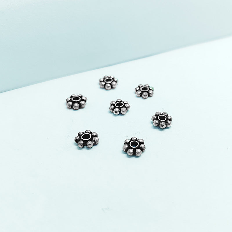 Floral spacer bead with center hole, Silver Overlay Over Copper, handcrafted in India for elegant jewelry designs.