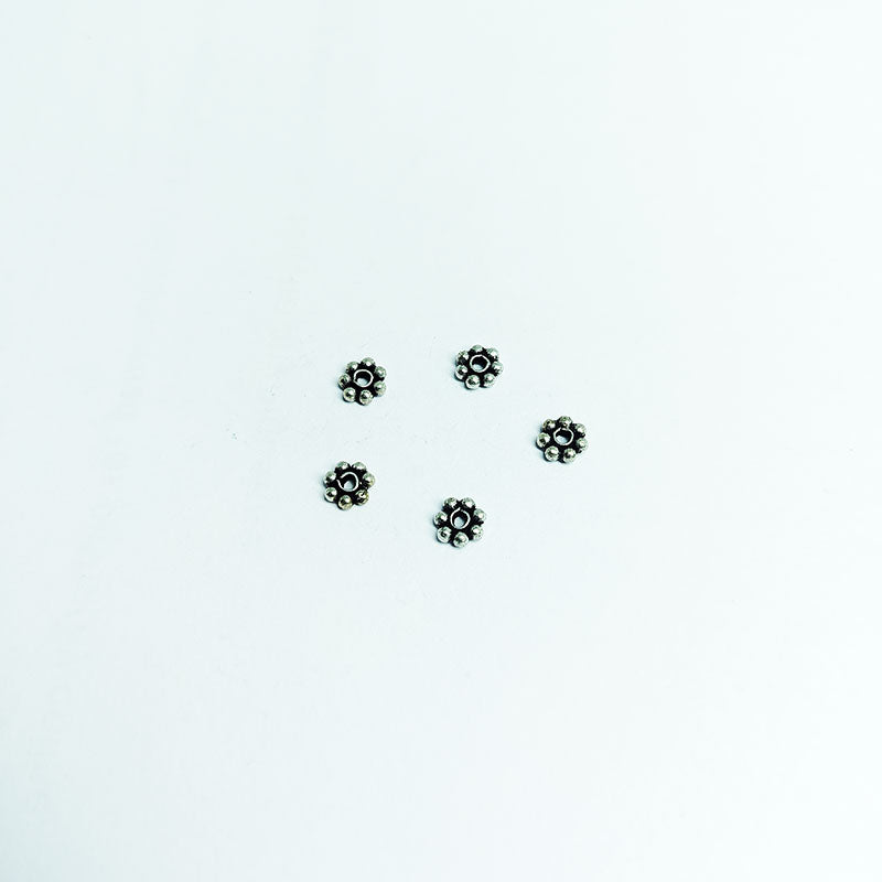 Floral spacer bead with center hole, Silver Overlay Over Copper, handcrafted in India for elegant jewelry designs.