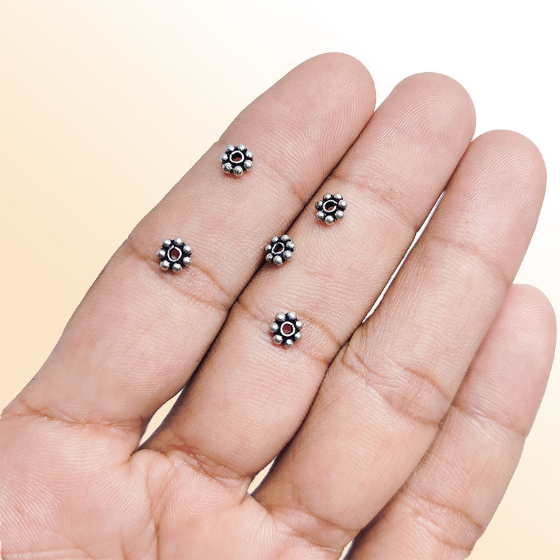 Floral spacer bead with center hole, Silver Overlay Over Copper, handcrafted in India for elegant jewelry designs.