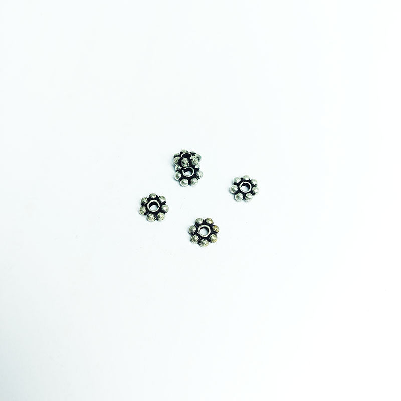 Floral spacer bead with center hole, Silver Overlay Over Copper, handcrafted in India for elegant jewelry designs.