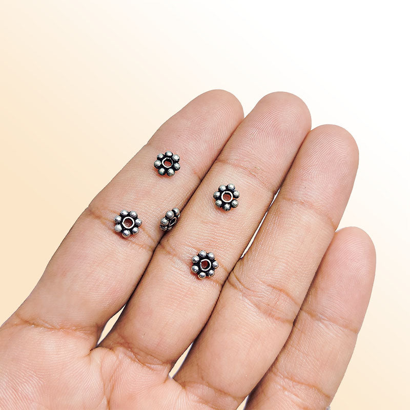 Floral spacer bead with center hole, Silver Overlay Over Copper, handcrafted in India for elegant jewelry designs.
