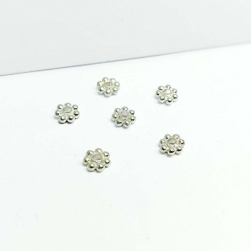 Floral spacer bead with center hole, Silver Overlay Over Copper, handcrafted in India for elegant jewelry designs.