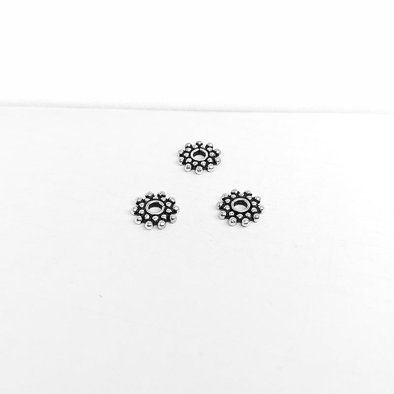 Silver overlay over copper round cluster spacer beads handcrafted in India with circular bubble design and polished finish.