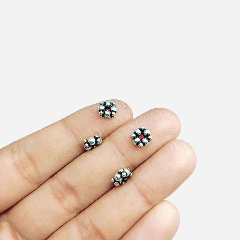 Silver overlay over copper rounded cluster spacer beads handcrafted in India with compact bubble design and polished finish.
