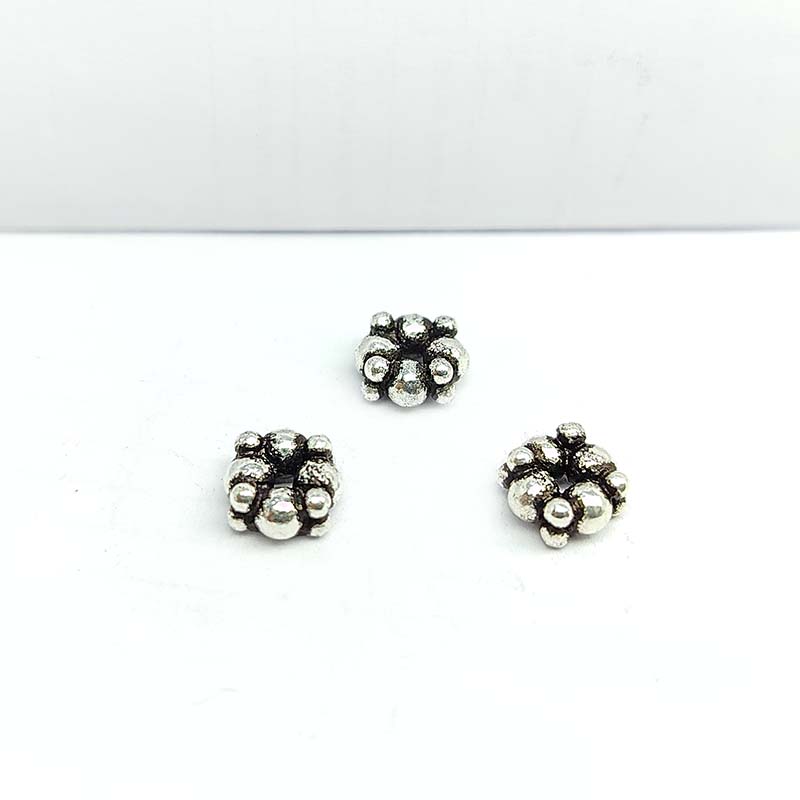 Silver overlay over copper rounded cluster spacer beads handcrafted in India with compact bubble design and polished finish.