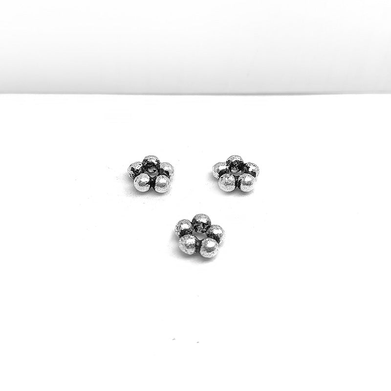 Silver overlay over copper small cluster spacer beads handcrafted in India with compact bubble design and polished finish.
