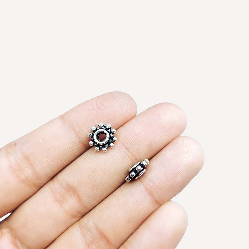 Silver overlay over copper traditional floral spacer charm, handcrafted in India for handmade jewelry designs.