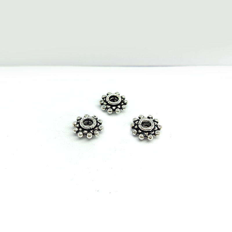Silver overlay over copper traditional floral spacer charm, handcrafted in India for handmade jewelry designs.