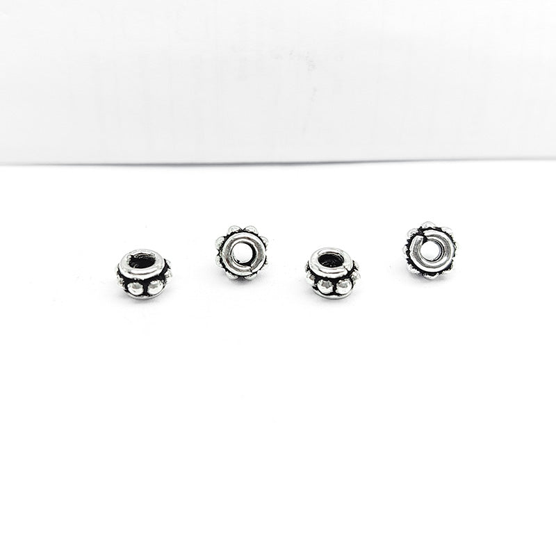 Silver Overlay Over Copper petite floral spacer charm, handcrafted in India for handmade jewelry designs.