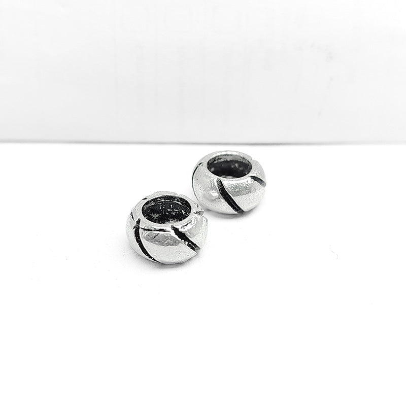 Silver Overlay Over Copper swirl texture spacer charm, handcrafted in India for handmade jewelry designs.