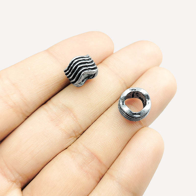 Silver Overlay Over Copper ripple texture spacer charm, handcrafted in India for handmade jewelry designs.