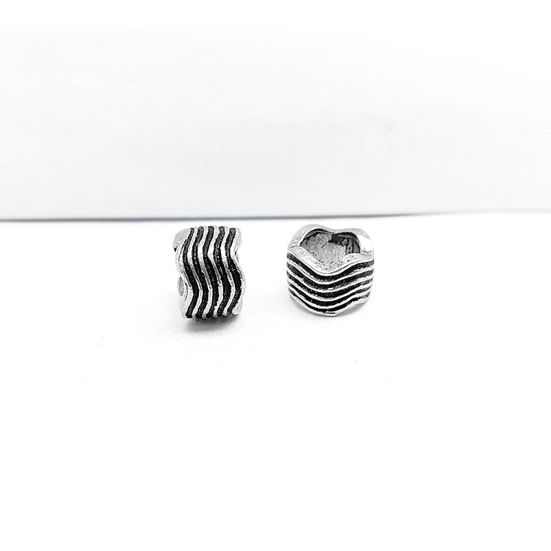 Silver Overlay Over Copper ripple texture spacer charm, handcrafted in India for handmade jewelry designs.