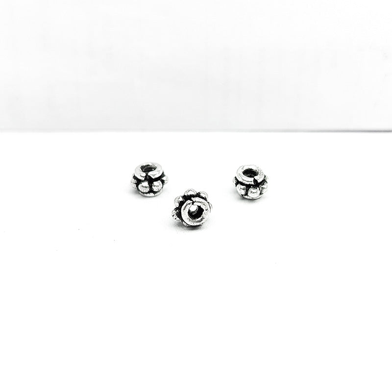 Silver Overlay Over Copper mini floral spacer charm, handcrafted in India for handmade jewelry designs.