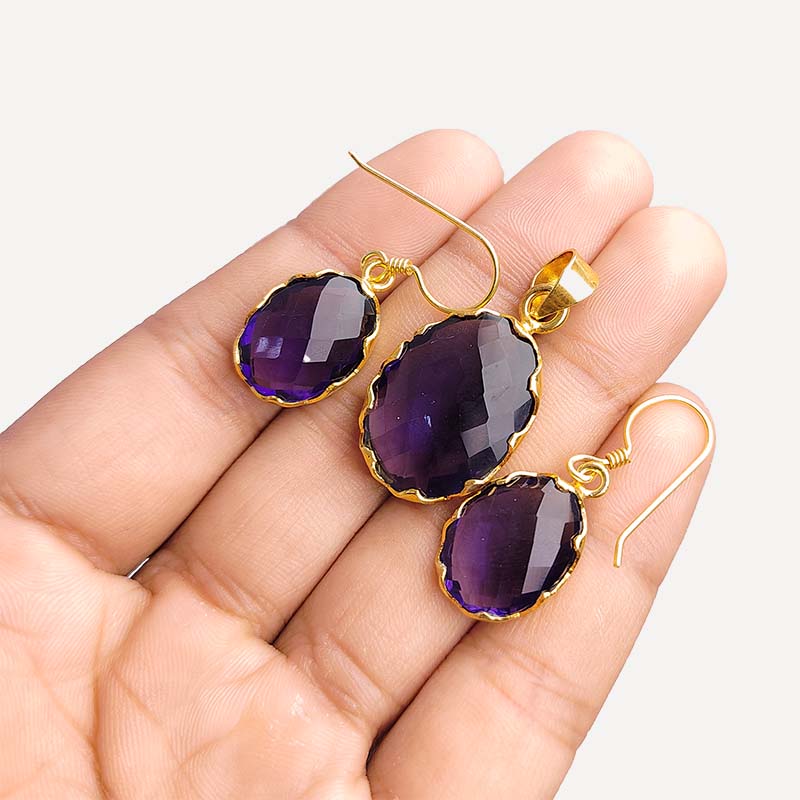Amethyst quartz oval pendant and earrings set with 18K gold overlay over copper and detailed faceted finish.
