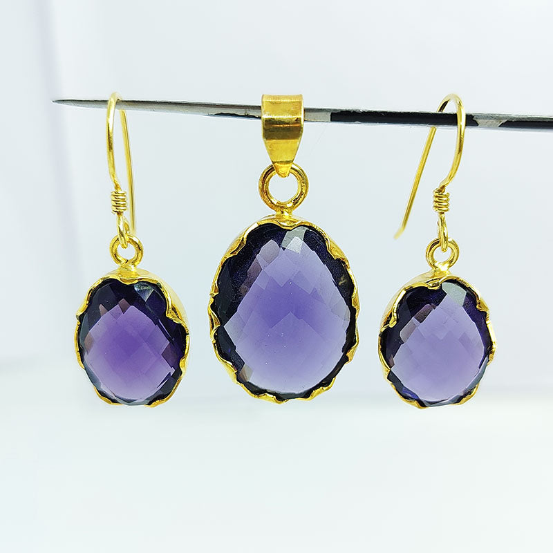 Amethyst quartz oval pendant and earrings set with 18K gold overlay over copper and detailed faceted finish.
