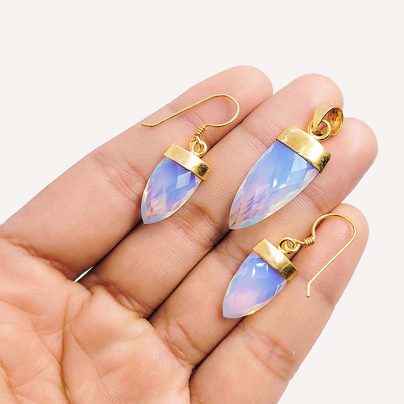 Crystal quartz spear-cut pendant and earrings with 18K gold overlay over copper and polished gold caps.
