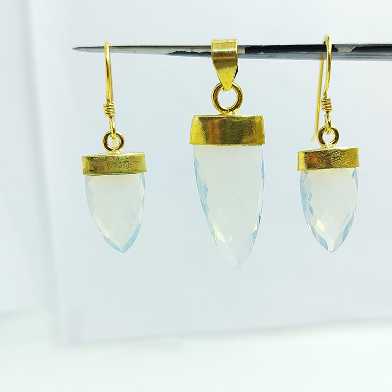 Crystal quartz spear-cut pendant and earrings with 18K gold overlay over copper and polished gold caps.