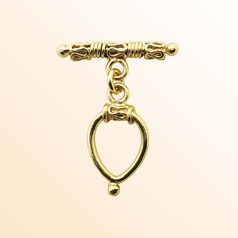 Handmade 18K gold overlay toggle clasp with ornate decorative bar and teardrop loop, crafted in India for bracelets and necklaces